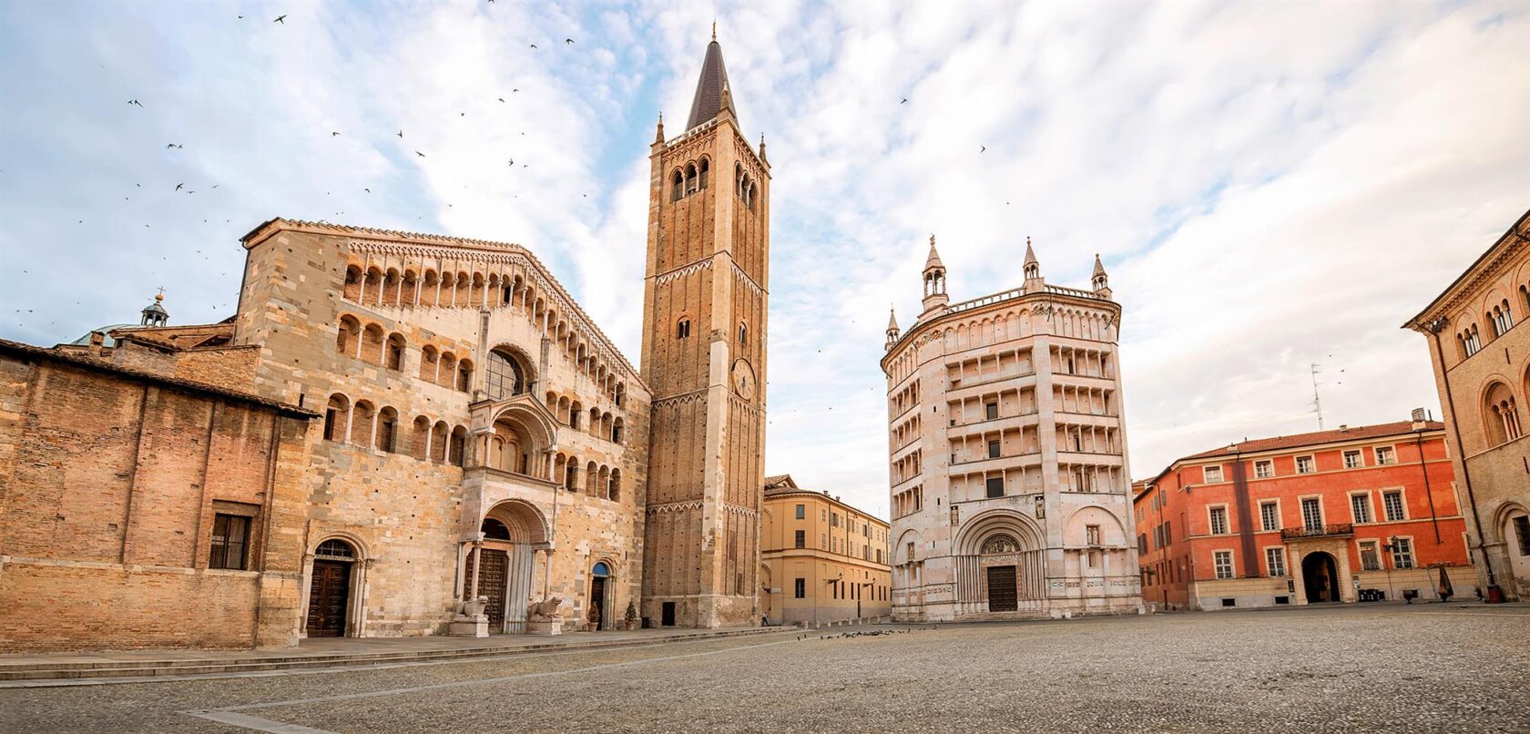 Parma cathedral with Baptistery leaning tower on the central square in Parma town in Italy